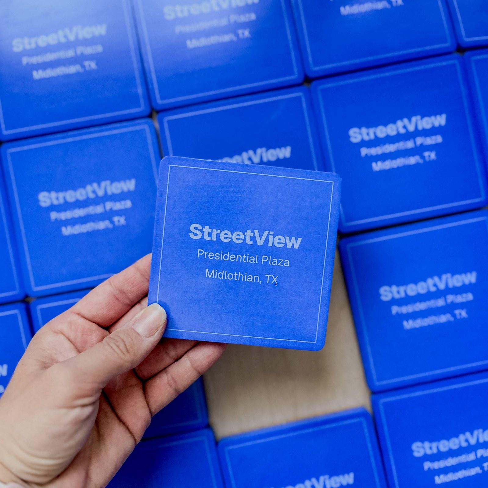 Blue square concrete coasters engraved for a Texas real estate development