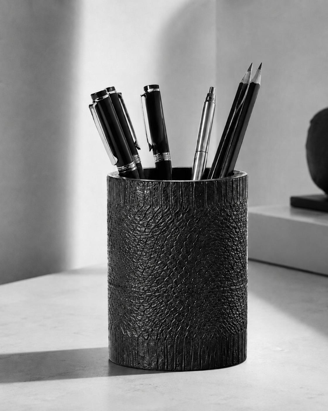 Textured black concrete pen holder cup with pens